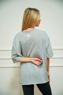 Women's featherlight oversized tee, front view on model — DWEGO