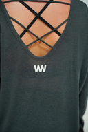 Women's sheer open-back top with crossover straps, front view on model — DWEGO