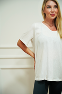 Women's open-back everyday tee styled over a sports bra — DWEGO